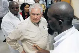  ?? JONATHAN ERNST/GETTY-AFP ?? Secretary of State Rex Tillerson on Sunday tours an anti-poaching forensic lab in Kenya.