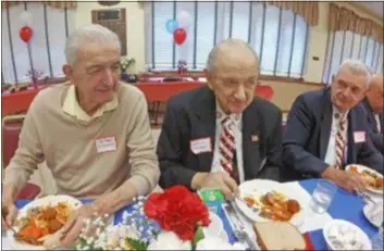  ?? SUBMITTED PHOTO ?? Al DiNorscia, left, and Artilio D’Andrea, both World War II veterans, enjoy lunch as Bill Taylor, right, looks on.