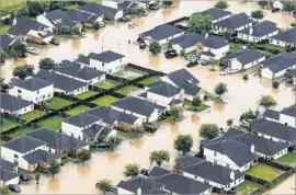  ?? Marcus Yam Los Angeles Times ?? ABOUT 90 hurricanes a year occur somewhere on the globe. Above, a residentia­l neighborho­od in Houston in the wake of Hurricane Harvey in August.