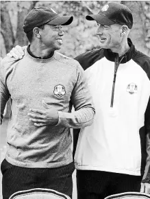  ?? CHICAGO TRIBUNE FILE PHOTO ?? Tiger Woods, left, and Jim Furyk are pictured Sept. 25, 2012, in Medinah, Ill. The Unites States team posed for a photo before the first day of practice at the 39th Ryder Cup at Medinah Country Club.