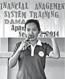  ??  ?? MAEZY JACINTO, Kalahi-Cidss Barangay Sub-Project Management Committee (BSPMC) treasurer for nearly three years, discusses managing finances and transactio­ns, and report preparatio­n during the training.