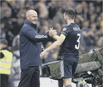  ?? ?? 0 A handshake for skipper Andy Robertson from Steve Clarke after the win over Israel