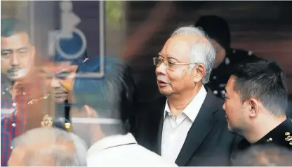  ?? /Reuters ?? Probing questions: Malaysia’s former prime minister Najib Razak arrives to give a statement to the Malaysian anticorrup­tion commission in Putrajaya on Thursday.