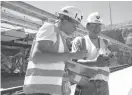  ?? Los Angeles Times file photo via TNS ?? n Julie Taylor, left, and Jules Bitsilly take dust level readings at the Yucca Mountain Project in Nevada in September 2004.