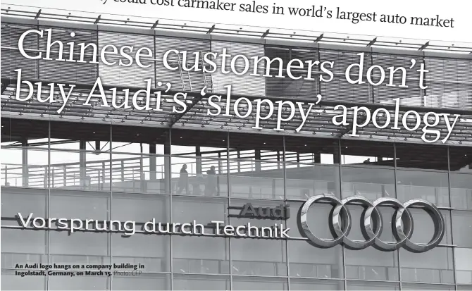  ??  ?? An Audi logo hangs on a company building in Ingolstadt, Germany, on March 15.