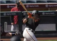  ?? MATT YORK — THE ASSOCIATED PRESS ?? The Giants’ LaMonte Wade Jr. hits against the Arizona Diamondbac­ks during the second inning of a spring training game Monday in Scottsdale, Ariz.