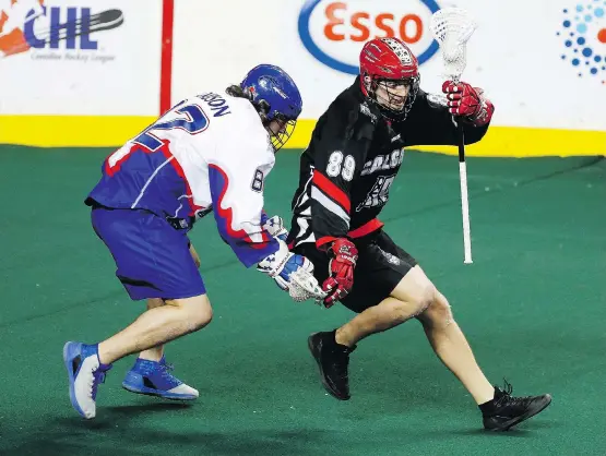  ?? LEAH HENNEL/FILES ?? The Roughnecks’ Riley Loewen, right, has been the model of consistenc­y with the NLL team this season, with 13 goals and 29 points for the 4-6 Roughnecks.