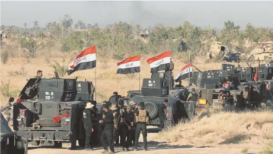  ?? AP PHOTO ?? ON THE ATTACK: Smoke billows on the horizon as Iraqi military forces prepare for an offensive into Fallujah to retake the city from Islamic State fighters in Iraq.