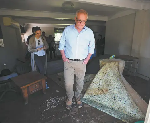  ?? AAP / Dean Lewins ?? Scott Morrison visits a flood-affected property in NSW last week.