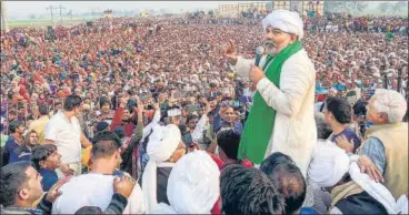  ?? PTI ?? Uttar Pradesh farm leader Rakesh Tikait addresses tens of thousands of farmers in Jind, Haryana, on Wednesday.