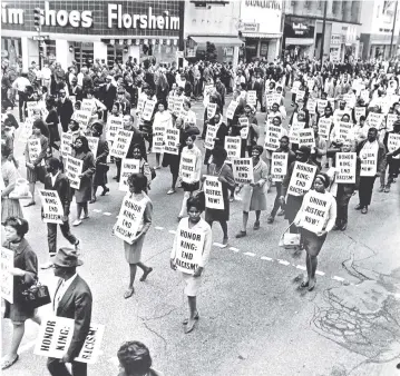  ?? PHOTOS FROM WITHERS FAMILY TRUST ?? This image taken at an April 8 memorial march honoring Dr. Martin Luther King Jr. can be viewed in the “Black Resistance: Ernest C. Withers and the Civil Rights Movement” exhibit at the Memphis Brooks Museum of Art.