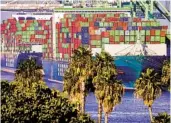  ?? MARIO TAMA GETTY IMAGES ?? Shipping containers are stacked on container ships at the Port of Los Angeles in November in San Pedro.