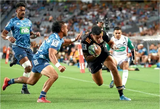  ?? GETTY IMAGES ?? Solomon Alaimalo is about to score a crucial try for the Chiefs in their pulsating win over the Blues in the Super Rugby season-opener in Auckland last night.