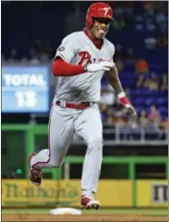  ?? WILFREDO LEE — THE ASSOCIATED PRESS ?? Rookie Nick Williams continued his impressive start, legging out the first two triples of his career and driving in a pair of runs, as the Phils racked up a season-high 20 hits Wednesday in a 10-3 romp past the Marlins.