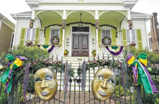  ?? Melissa Phillip / Staff photograph­er ?? Since the pandemic forced the cancellati­on of traditiona­l Mardi Gras festivitie­s, Galveston residents decided to celebrate as a community by decorating their homes.