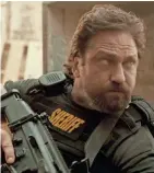  ??  ?? Gerard Butler leads a no-holds-barred unit of the Los Angeles County Sheriff's Department in "Den of Thieves." STX ENTERTAINM­ENT