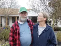  ??  ?? Bruce Pardue and his fiancée, Patria Louis, stand in what was once their front yard. He has expanded his business to the point they needed the space to hold his hundreds of roses for the nursery. But it makes for a gorgeous sight.