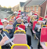  ??  ?? RAF ST Athan carolling in Llantwit Major last Saturday and Bridgend on Sunday on their specially hired open-top bus