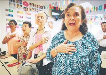  ?? Mario Tama Getty Images ?? THE PLEDGE of Allegiance is recited last week during a class for immigrants seeking U.S. citizenshi­p. The Trump administra­tion has proposed denying citizenshi­p to immigrants who use public assistance programs.