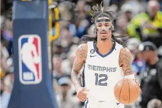  ?? David Zalubowski/Associated Press ?? Memphis Grizzlies guard Ja Morant plays in the second half of a game agianst the Denver Nuggets on March 3 in Denver.