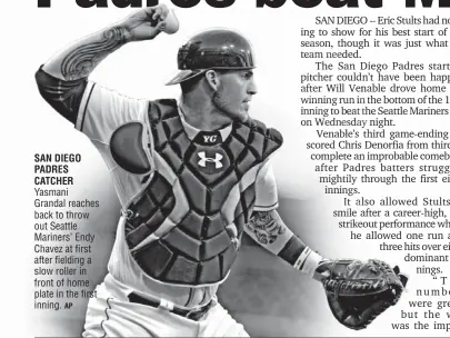  ?? AP ?? SAN DIEGO PADRES CATCHER Yasmani Grandal reaches back to throw out Seattle Mariners’ Endy Chavez at first after fielding a slow roller in front of home plate in the first inning.