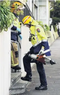  ?? PHOTO: STEPHEN JAQUIERY ?? Keeping it in house . . . A firefighte­r carries cutting equipment into Dunedin Hospital after a man was stuck in an Xray machine in 2017.