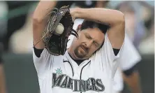  ?? Ted S. Warren / Associated Press ?? Mariners pitcher Bryan Shaw reacts to an eightrun onslaught by the A’s, who won 111 in Seattle.