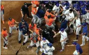  ?? AP PHOTO/GODOFREDO A. VÁSQUEZ, FILE ?? FILE - Players from Houston Astros and Texas Rangers clear the benches after Texas Rangers’ Adolis Garcia was hit by a pitch thrown by Houston Astros relief pitcher Bryan Abreu during the eighth inning in Game 5 of the baseball American League Championsh­ip Series, Friday, Oct. 20, 2023, in Arlington, Texas.