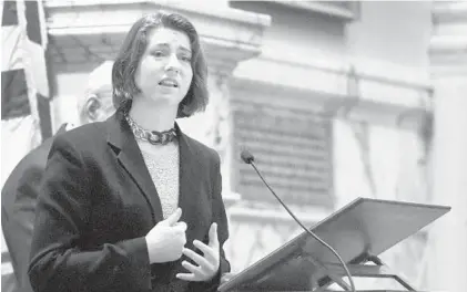  ?? KIM HAIRSTON/BALTIMORE SUN ?? Montana Geimer speaks to members of the Maryland House of Delegates after accepting the Speaker’s Medallion presented posthumous­ly to her mother, Wendi Winters, by Speaker Michael Busch. Winters was one of five people killed at The Capital Gazette last year.