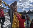  ?? ?? Gold streamers go up at Pleasant Valley High School in Chico on Friday.