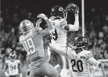  ?? Rick Osentoski, The Associated Press ?? Chicago Bears free safety Eddie Jackson intercepts a pass intended for Detroit Lions wide receiver Kenny Golladay to seal the win over the Lions on Thursday in Detroit.