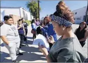  ?? Al Seib Los Angeles Times ?? STUDENTS in Alhambra outside Everest College, among the Corinthian schools that closed in 2015.