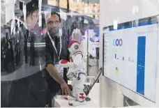  ?? Reem Mohammed / The National ?? Robots of all shapes and sizes feature at Gitex Technology Week at Dubai World Trade Centre