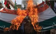  ?? AFP/GETTY IMAGES FILE PHOTO ?? Pakistani activists from the banned organizati­on Jamaat-udDawa burn an Indian flag during a protest in Quetta.