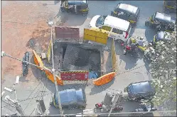  ?? VIJAY BATE/HT PHOTO ?? An overloaded dumper ran on the storm water drain, cracking its cover (below). This spot on Tiwari Chowk has been barricaded (above).