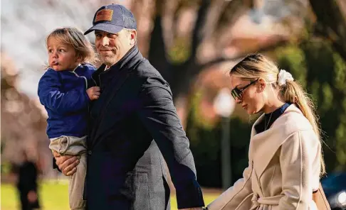  ?? Al Drago/For The Washington Post ?? Hunter Biden, son of President Joe Biden, on the South Lawn of the White House in Washington, D.C., with son, Beau Biden Jr., and wife, Melissa Cohen, on Dec. 4, 2022. Hunter Biden has sued a computer repair shop owner over the release of a laptop.