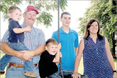  ?? FILE PHOTOS ?? Lincoln residents, Allen and Cindy Moore and their three sons, were named the 2017 Farm Family of the Year. Moore Valley Farms grows row crops.