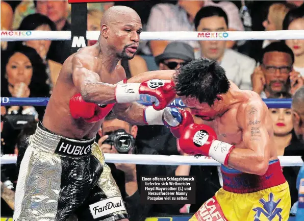  ??  ?? Einen offenen Schlagabta­usch lieferten sich Weltmeiste­r Floyd Mayweather ( l.) und Herausford­erer Manny Pacquiao viel zu selten.