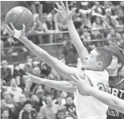  ?? NEWS GROUP CURT HOGG / NOW ?? Nicolet guard Sonny Phinisee goes up for a layup against Port Washington on Wednesday night.