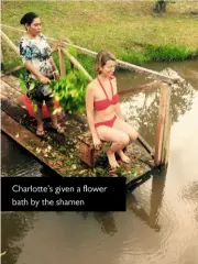  ??  ?? Charlotte’s given a flower bath by the shamen