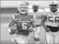  ?? NWA Democrat-Gazette file photo ?? Henre Toliver will be the Arkansas Razorbacks’ primary punt returner tonight against Florida A&M even if Jared Cornelius is able to play.