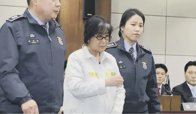  ??  ?? 0 Choi Soon-sil, the jailed confidante of disgraced South Korean President Park Geun-hye, appears on the first day of her trial
PICTURE: AFP/GETTY IMAGES