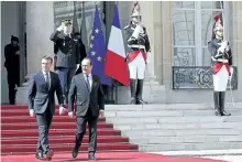  ?? THIBAULT CAMUS/THE ASSOCIATED PRESS ?? New French President Emmanuel Macron bids farewell to former French President Francois Hollande, right, after the inaugurati­on ceremony at the Elysee palace in Paris, France, on Sunday.