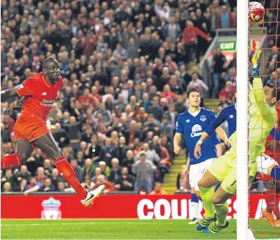  ?? Picture: AP. ?? Everton keeper Joel Robles cannot keep out a header from Mamadou Sakho during the Merseyside derby at Anfield last night.