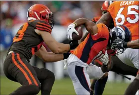  ?? DAVID ZALUBOWSKI — THE ASSOCIATED PRESS ?? Browns middle linebacker Joe Schobert strips the ball from Broncos wide receiver Diontae Spencer (11) during the first half Nov. 3in Denver.
