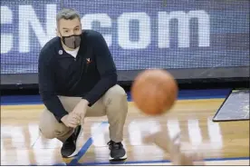  ?? AP photo ?? Virginia coach Tony Bennett watches his team play against Syracuse in the Atlantic Coast Conference quarterfin­als on Thursday. The 16th-ranked Cavaliers pulled out of the tournament Friday after returning a positive COVID-19 test.