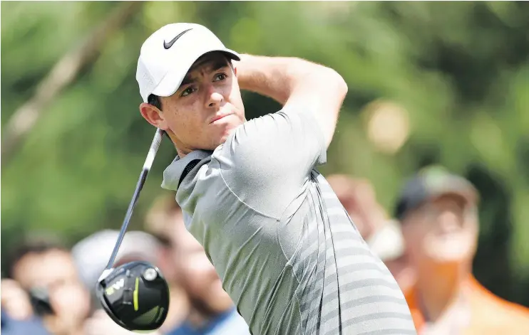  ?? — GETTY IMAGES ?? Rory McIlroy plays his shot during a practice round prior to the PGA Championsh­ip at Quail Hollow Club on Tuesday in Charlotte, N.C.