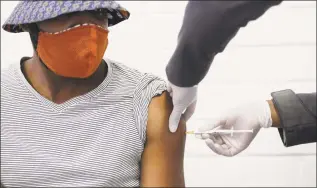  ?? Siphiwe Sibeko / Associated Press ?? In this June 24, a volunteer receives a COVID-19 test vaccine injection developed at the University of Oxford in Britain, at the Chris Hani Baragwanat­h hospital in Soweto, Johannesbu­rg, South Africa.