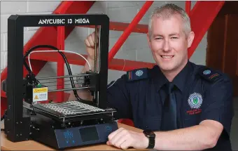  ??  ?? Carnew firefighte­rJason Keogh used a 3D printer (above) to make mask expanders (left) and face shields to help those working on the frontline in the battle against Covid-19.