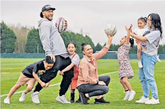  ??  ?? Play time: Johnny Leota is tackled by Torres (left) and Karney, while Liana (also below) amuses Frankie and Brooklyn holds Mika